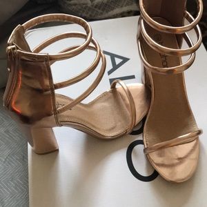 Rose gold heels.